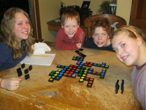 Kids playing Qwirkle